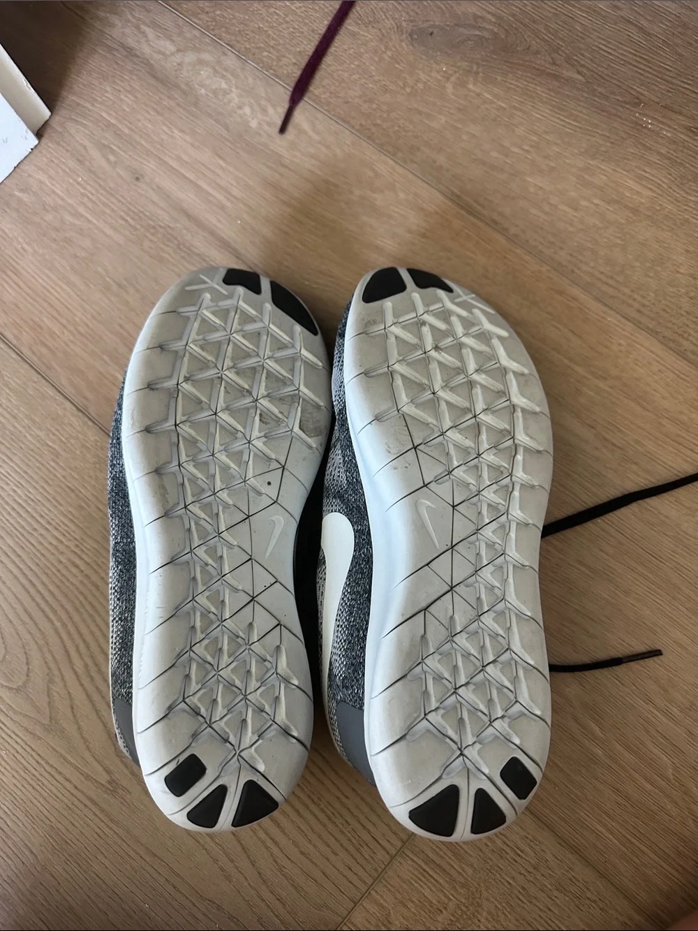 Nike Grey and Black Knit Sneakers with White Swoosh